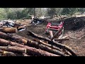 Moving Logs and a wood shed with Skidsteer!