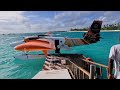 Seaplane full landing at Sun Siyam Iru Fushi, Maldives, with the resort's very own branding/livery