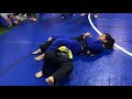 Girl armbars boy at jiu jitsu tournament