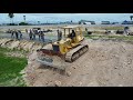 New project!! Huge Landfill by bulldozer D58E Komatsu pushing soil, 5tons truck unloading