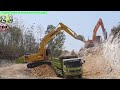 Excavator Dump Truck Digging Limestone On Road Construction Kobelco SK200 Komatsu PC200