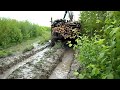 Forestry tractor logging in water and mud