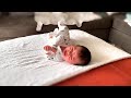 Newborn rolls over at just 23 days old