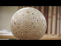 Guy makes a big ball out of plywood