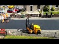 Time-lapse of construction workers removing old slabs and laying asphalt.