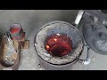 Scrapping copper into bullion bars using sand casting molds.