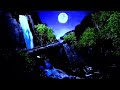 A relaxing rushing waterfall all the way over the cliffs and the full moon