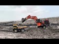 Hitachi Ex 2600 Excavator Loading Caterpillar truck and Komatsu trucks ~ Miningstory