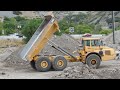 Volvo Dump Truck driving and dumping