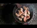 camping with friends in foggy weather - cooking and relaxing in wild nature