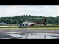 Bell 206 landing in KBMG