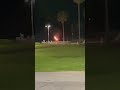 Fire man practicing for burning man in Venice beach at night