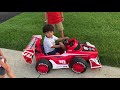 Aaron driving Race  Disney car in the neighborhood!