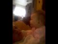 7 month old baby girl giving kisses to Mommy