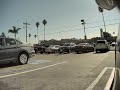 Woman opens car door into Tesla Model X side view mirror and flees