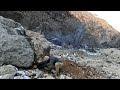 Building a shelter under a big rock in freezing weather