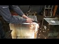 old pro using a plasma cutter to trim ductwork.