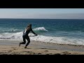 Expert Skimboarders Try to Catch Waves