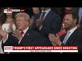 Crowd erupts in applause as wounded but defiant Donald Trump appears at RNC