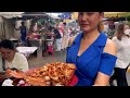 Tables always fully booked! Amazing fried tilapia fish with peanuts crispy garlic | Thai street food