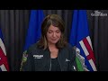 Alberta premier holds back tears as wildfire rages in western Canada