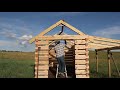 Off Grid Log Cabin, Setting Trusses with Wood and Iron
