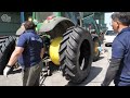 Process of turning old tractor tire into new tire. Korean skilled mechanic