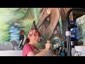 Live painting a studio mural