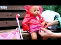 Rainy boots and raincoat for Baby Annabell doll. Baby doll goes for a walk. Dolls videos for kids.