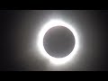 Solar Eclipse 2024. And red dot aka the sun peaking through a valley on the moon. From Ohio.