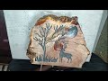 A Wood Carving of a Deer, Tree, and Glowing Moon Sealed with Epoxy Resin
