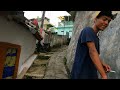 Walking in the narrow alley of Kebalen Malang Dense Settlements in Malang City, East Java, Indonesia