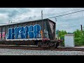 Norfolk Southern and CSX freight trains at Amity Street level railroad crossing (Homestead, PA)