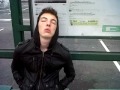 Funny guy asleep at the bus stop