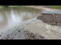 Spillway washing away and holes forming