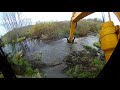 Demolition of a beaver dam with a JCB180 excavator
