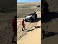 Rivian Electric Truck stuck in sand dune at Superstition Mountain OHV Area.