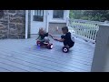 The children ride their hoverboards on the porch while squatting.
