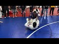 Armbar from back take at jiu jitsu tournament