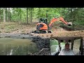 Building Log Bridge Across Black Pond Muck