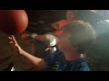 Guy spins other guys balls