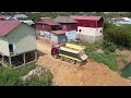 Massive Skill Operator Machine on Construction Truck Spreading Dirt in Water Wheel Loader Pushing It