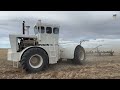 Big Bud HN320 Tractor pulling a Melroe Chisel Plow near Shelby Montana