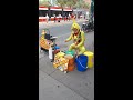 Street Busker at Dundas and Spadina.