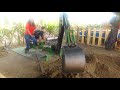 Ryo using a digger at Tanaka Farm