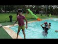 he plays with balloons in the pool