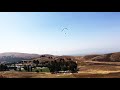 Relaxing Music Meets Majestic Views: A Paragliding Flight with Red-Tailed Hawk