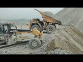 Powerful Komatsu D375A-8 Bulldozer Pushing Large Mterial Over Safety Bank Amzing Machines at Work