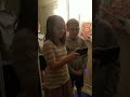 Twins trying a song and being silly