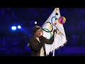 Simone Biles CRYING as she hands the Olympic flag to Tom Cruise in memorable moment